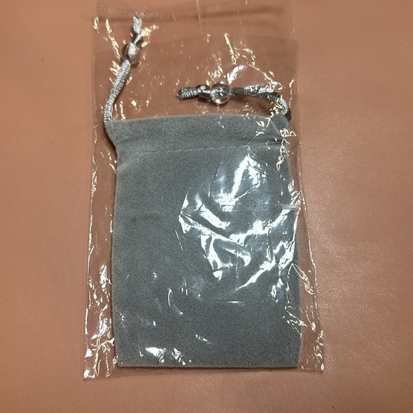 New in package anniversary metal card in a gray cloth pouch - Picture 3 of 5